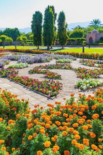 Park decorated with flowers in front of the Sultan Qaboos Mosque, Muscat, Arabian Peninsula,