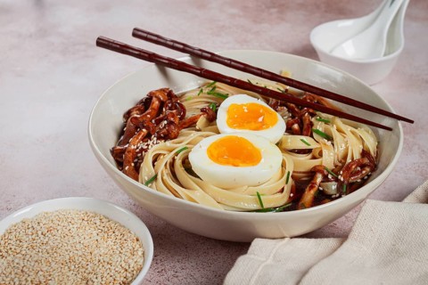 Buckwheat noodles soba with shimeji mushrooms, with boiled egg, green onion, sesame seeds,