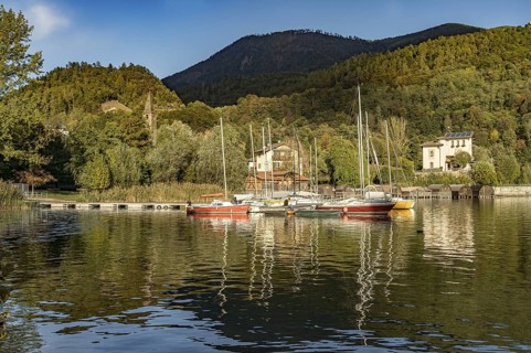 Sailing boats on Lake Caldonazzo in Valsugana near San Cristoforo, Trentino, Italy
