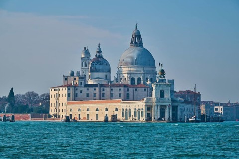 View from the water on church 'Basilica di Santa Maria della Salute' in Venice on a sunny day in
