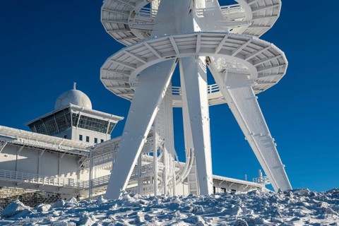 Lower part of the telecommunications tower on the Brocken summit, radar station in the background,
