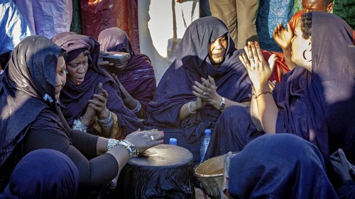 Women in a circle, drumming and praying, emotional and community orientated, Traditional woman