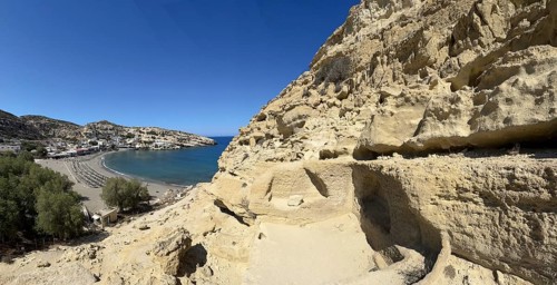 View of entrances of caves in sandstone rocks of former Roman necropolis with sandstone caves