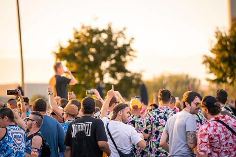 Large crowd at a concert, lots of colourful outfits and movement, Malleparty Böblingen, Germany