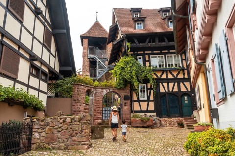 Mother and son in the old town of Gengenbach in the Black Forest, Germany, family vacation concept