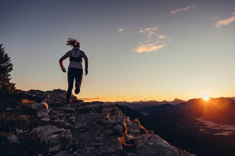 Trail running in autumn on the Jochberg on Lake Walchensee against the wonderful backdrop of the