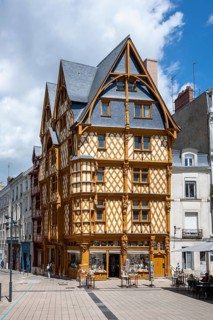 Historic half-timbered house from the late 15th century with a distinctive, steep roof structure