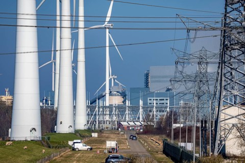Wind farm and the Eemshaven coal power plant, right, Eemshavencentrale, operated by RWE Generation,