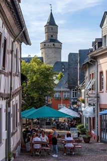Obergasse with alleyway restaurant, witch tower keep at the back, butter barrel tower, historic old