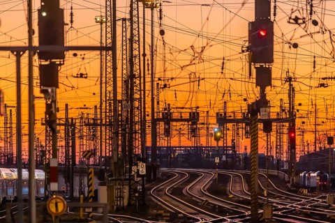 Track apron in the evening with sunset. Frankfurt am Main main station with rails, line mast and