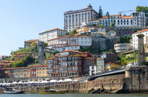 Historic riverside buildings on hillside of Ribeira next to River Douro, Porto, Portugal, Europe