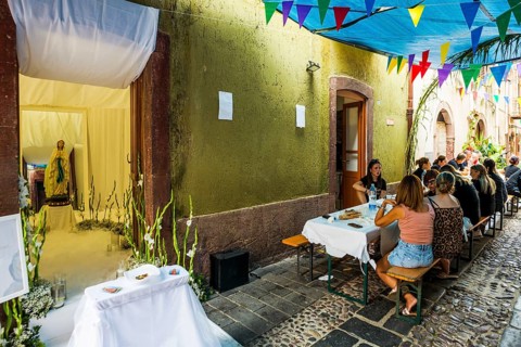 Decorated alley and celebrating people, feast of the Madonna of Regnos Altos, Bosa, district of