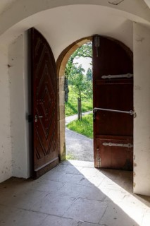 View through an open door into the greenery, Pavilion at Michaelisberg, Bamberg, Bavaria, Germany