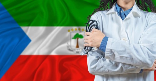 Healthcare professional with Equatorial Guinea flag background. Professional doctor holding