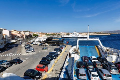 Parking cars, ferries to Palau in port, pier, La Maddalena island, archipelago, Tyrrhenian Sea,
