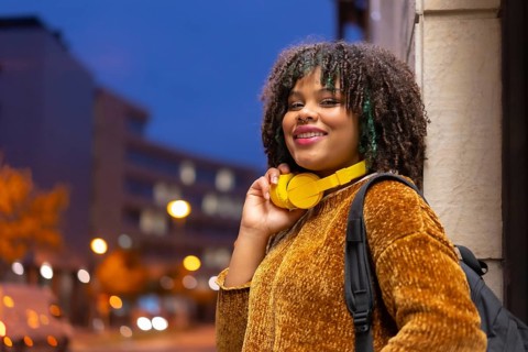 Portrait of black ethnic girl in the early morning going to the university on the way back to