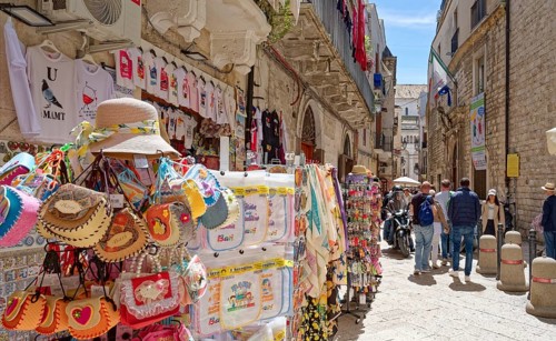 Tourists and souvenirs in Bari Veccia, the old town of the southern Italian city of Bari. Bari,