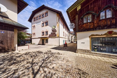 Fashion, sports and traditional costume Dollinger, fashion store, cosmetic studio, pedestrian zone,