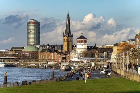 City view with Rhine promenade, St. Lambert's Basilica, castle tower, Tonhalle and Ergo Tower in