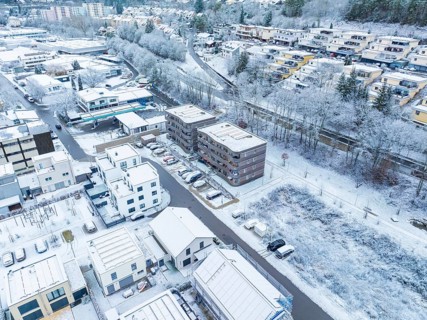 Bird's eye view of a snow-covered town with blocks of flats and streets, Nagold, Black Forest,