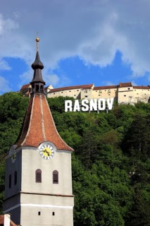 Town of Rasnov, German Rosenau. In the foreground is the distinctive clock tower of the Protestant