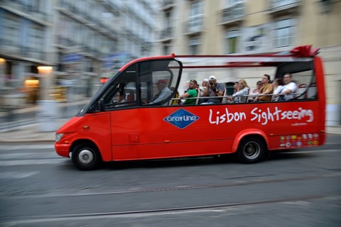 Sightseeing bus with tourists, Alfama, Lisbon, Lisbon District, Portugal