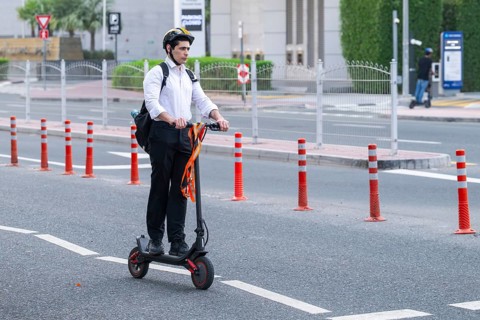 Man with e-scooter, Dubai, United Arab Emirates, UAE