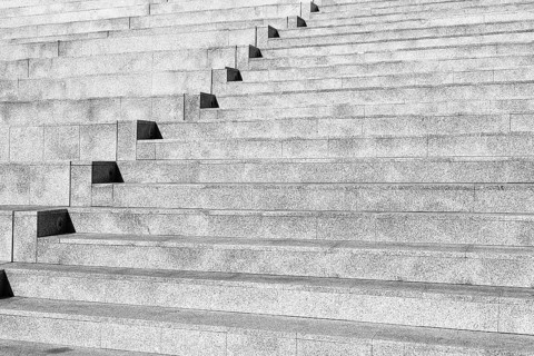 Dreary outdoor concrete staircase, bare steps in the city, detail, symbol image, wallpaper