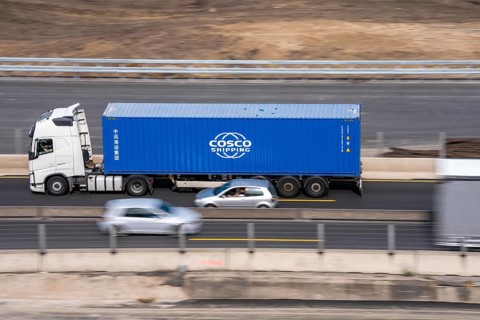 Container truck on the highway, Cosco Shipping