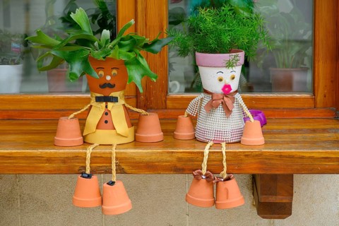 A window sill decorated with flowerpot characters in the Bašcaršija (Old Town) district ofSarajevo,