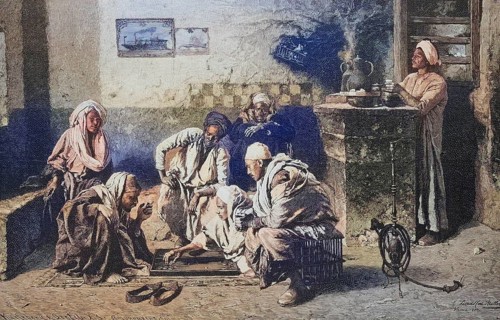 Trick-track player in an Egyptian coffee house, two men playing, other Arabs watching. A servant