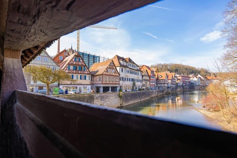 View of a historic town with half-timbered houses by a river, Schwäbisch Hall, Germany