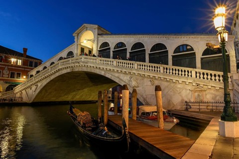 Gondolas on the Grand Canal in front of the Rialto Bridge, blue hour, Venice, San Marco district,
