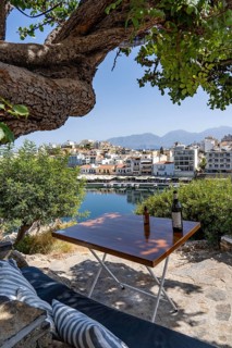 Taverna Gioma above the village of Agios Nikolaos, in the eastern part of Crete, view over Lake