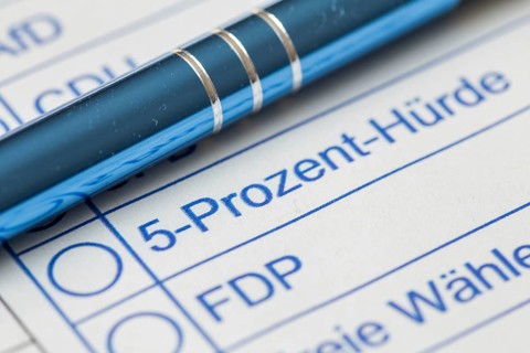 Close-up of a symbolic ballot paper with the text 5 PERCENT HURDLE