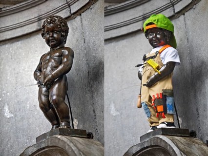Bronze statue Manneken Pis, fountain figure of a urinating boy with and without costume, a landmark