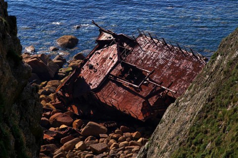 MV RMS Mülheim shipwreck, German cargo ship, stranded, rusted, headland Land's End, Penzance,