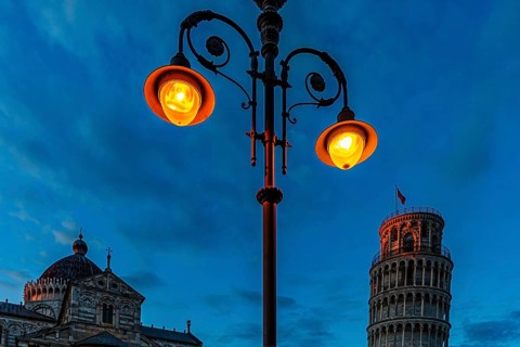 The Cathedral of Santa Maria Assunta and the Leaning Tower in the evening light under an