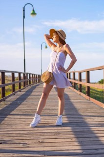 Portrait of caucasian brunette woman on the beach in summer vacation