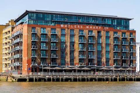 The converted Victorian Butler's Wharf warehouse with its riverside apartments and terrace