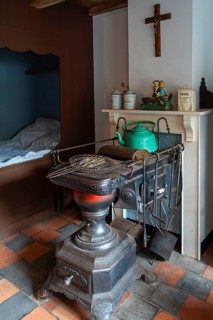 Antique Flemish cast-iron coal stove, Leuvense stoof at the NAVIGO Visserijmuseum, fishery museum