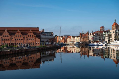 GDANSK, POLAND - SEPTEMBER 6, 2023: River Motlawa and cityscape during summer day