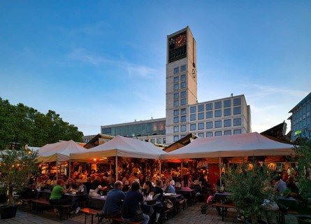 Outdoor catering, people sitting in Weinlauben, Weindorf, restaurant Rauschenberger, behind it New