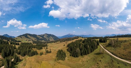 Drone shot of the Illingeralm with a view of the Pillsteinhöhe and Zwölferhorn, Osterhorn group,