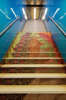 Futuristically designed Università metro station, steps with portrait of Dante Alighieri art