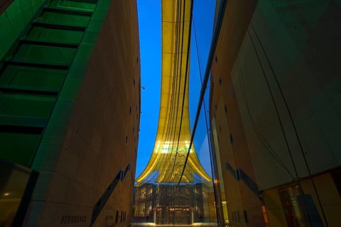 Reflection in the façade of the State Museum of Art and Design at dusk, Nuremberg, Middle