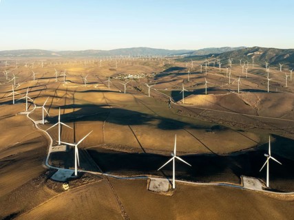 Windmills on a wind farm near Zahara de los Atunes. Aerial view. Drone shot. Cádiz province,