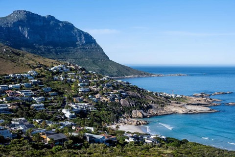 Sea Point, homes and mountains along a picturesque coastal bay with blue water, Eastern Cape, Cape