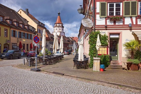 Entrance to the restaurant and pizzeria Michelangelo and Niggelturm in rainy weather in Gengenbach,