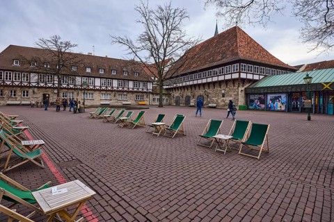 Gastronomy, outdoor area with tables and chairs, half-timbered houses, concrete paving stones, bare